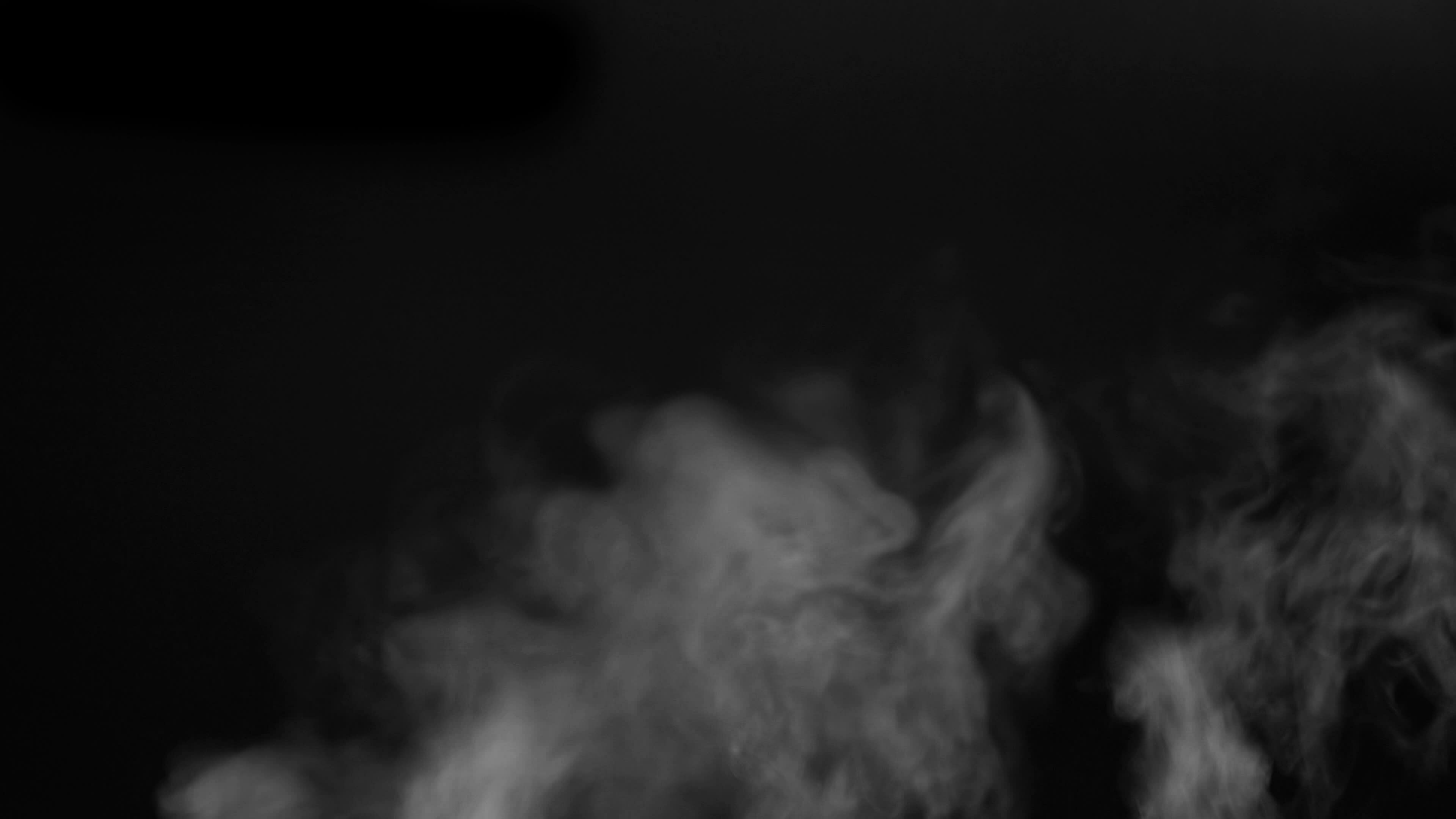 The water spray steam or smoke motion isolated on black background