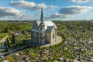 aerial view on neo gothic temple or catholic church in countryside photo