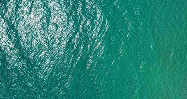 Vertical drone video on the turquoise sea surface