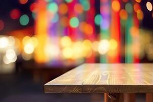 Wooden table in front of abstract blurred background of colorful restaurant lights. photo