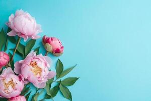 Spring peony flowers bouquet on pastel background top view in flat lay style. photo