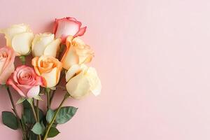 Spring rose flowers bouquet on blue pastel background top view in flat lay style. photo