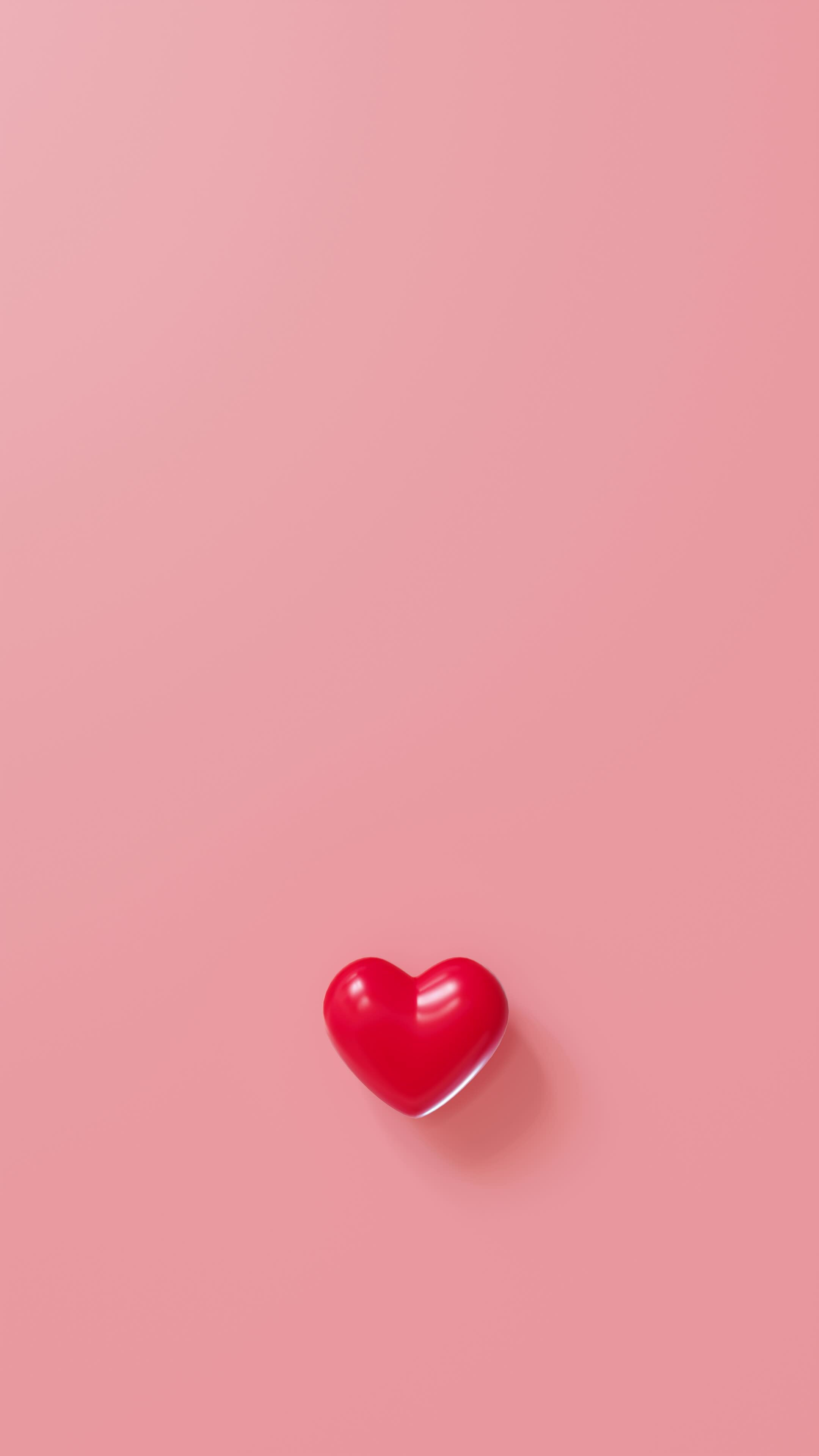 Red animated heart on pink background with copy space. Valentine\'s ...