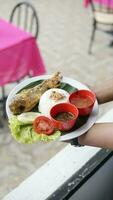 Fried fish served with steamed rice,Thai food. photo