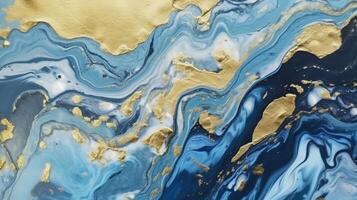 A blue and gold marble painting with gold paint. photo