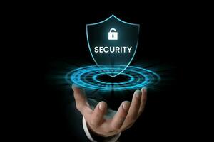 Businessman holding digital security icon in the hand, internet security concept. photo