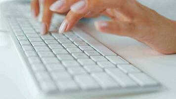 Female hands typing on a computer keyboard. Concept of remote work video