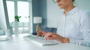 Female hands typing on a computer keyboard. Concept of remote work video