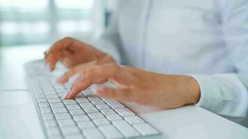 Female hands typing on a computer keyboard. Concept of remote work video