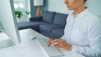 Female hands typing on a computer keyboard. Concept of remote work video