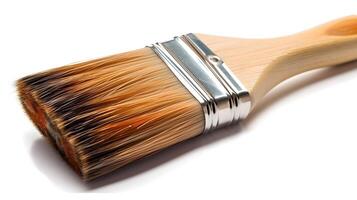 Close up of medium size paint brush isolated on white background studio shot. photo