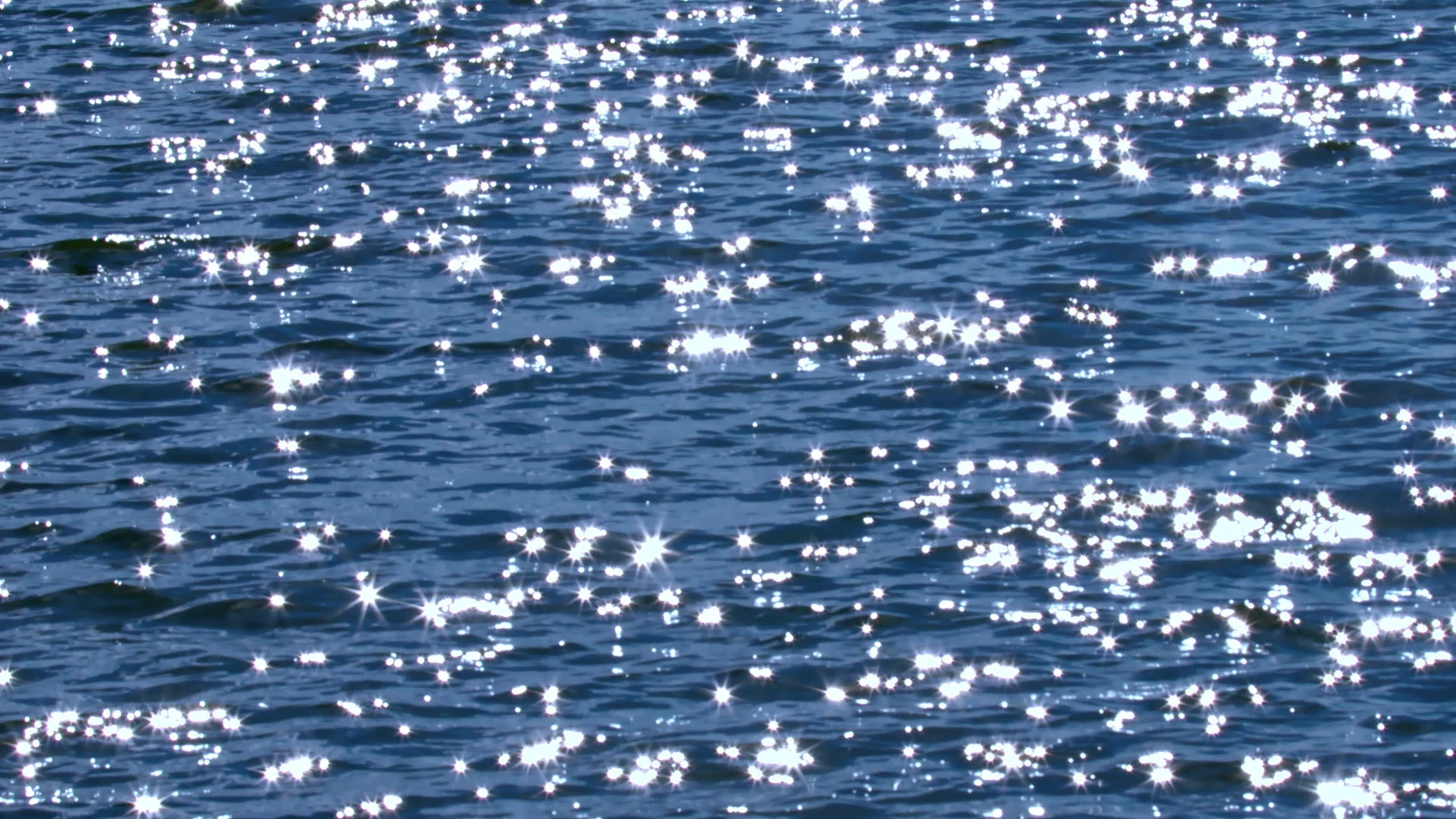 Sun Glitter Sparkles On The Blue Sea 23802131 Stock Video at Vecteezy