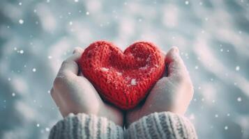 Hands with knitted heart in winter. Illustration photo