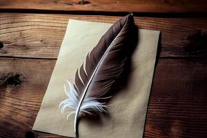 Wonderful Feather on a blank sheet of paper as a symbol of poetry in the wood background. photo