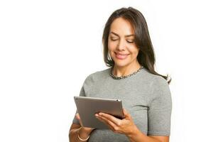 Young professional woman using a tablet isolated on white background photo