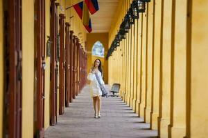 Beautiful woman walking around the walled city in Cartagena de Indias photo