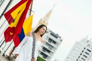 Beautiful woman walking around Cartagena de Indias next to the famous Clock Tower photo