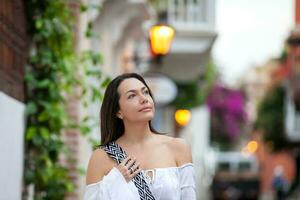 Beautiful woman at the streets of the walled city in Cartagena de Indias photo