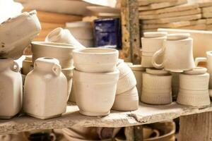 Ceramics on the elaboration process at a traditional factory at the small city of Raquira in Colombia photo