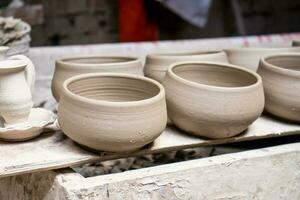 Ceramics on the elaboration process at a traditional factory at the small city of Raquira in Colombia photo