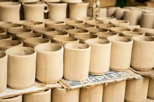 Ceramics on the elaboration process at a traditional factory at the small city of Raquira in Colombia photo