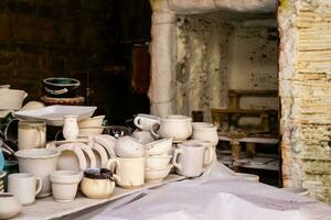 Ceramics on the elaboration process at a traditional factory at the small city of Raquira in Colombia photo