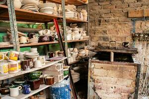 Ceramics on the elaboration process at a traditional factory at the small city of Raquira in Colombia photo