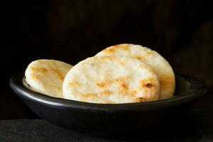 Roasted traditional Colombian white corn arepa photo