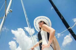 Beautiful woman at a luxury sailboat in a sunny day in Cartagena de Indias photo