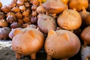 Clay piggy banks at a traditional ceramics factory in the beautiful small town of Raquira in Colombia. City of Pots photo