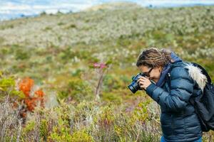 Young woman exploring the nature of a beautiful paramo at the department of Cundinamarca in Colombia photo