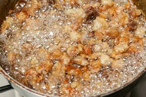 Pork cracklings preparation.  Plantain croquettes sttufed with pork cracklings. Marranitas or puerquitas photo