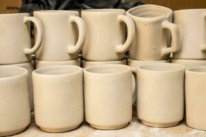 Ceramics on the elaboration process at a traditional factory at the small city of Raquira in Colombia photo