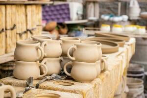 Ceramics on the elaboration process at a traditional factory at the small city of Raquira in Colombia photo