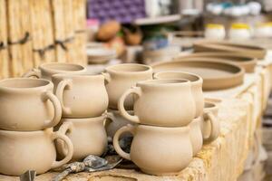 Ceramics on the elaboration process at a traditional factory at the small city of Raquira in Colombia photo
