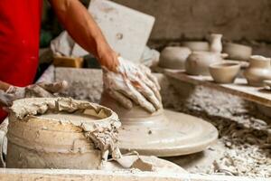 Ceramics on the elaboration process at a traditional factory at the small city of Raquira in Colombia photo