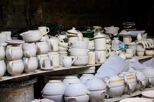 Ceramics on the elaboration process at a traditional factory at the small city of Raquira in Colombia photo