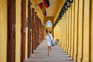 Beautiful woman walking around the walled city in Cartagena de Indias photo