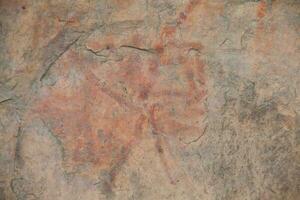 Prehistoric paintings on rock known as petroglyphs in Colombia photo