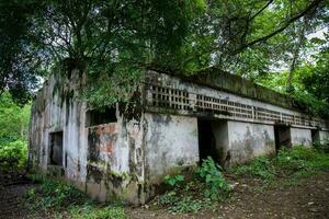 Remains of the destroyed San Lorenzo Hospital of the Armero Town buried by the avalanche up to the second floor after 37 years of the tragedy caused by the Nevado del Ruiz Volcano in 1985 photo