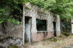 Remains of the destroyed houses of the Armero Town covered by trees and nature after 37 years of the tragedy caused by the Nevado del Ruiz Volcano in 1985 photo