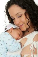 Beautiful young mother with her one month baby girl isolated on white background photo