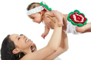 Young parents playing with their four months old baby girl photo