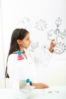 Young girl playing a life sciences professional role. Could be biologist, doctor, researcher. Dreaming about the future. photo