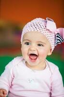 Portrait of a beautiful nine months baby on a colorful background. Happiness concept photo