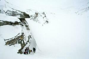 Baikal mountains in winter in snow. Forest in snow covered mount photo