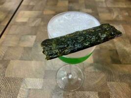 green drink with nori on it photo