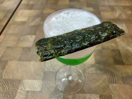 green drink with nori on it photo