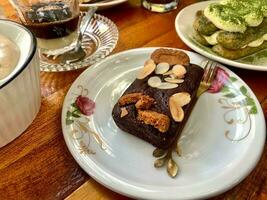 pieces of chocolate steamed cake served on a coffee shop table photo