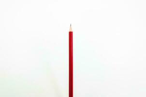 Red pencil  on white background photo